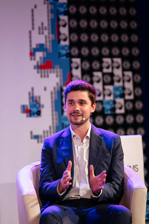 A QuantumNova talk on stage at a technology conference