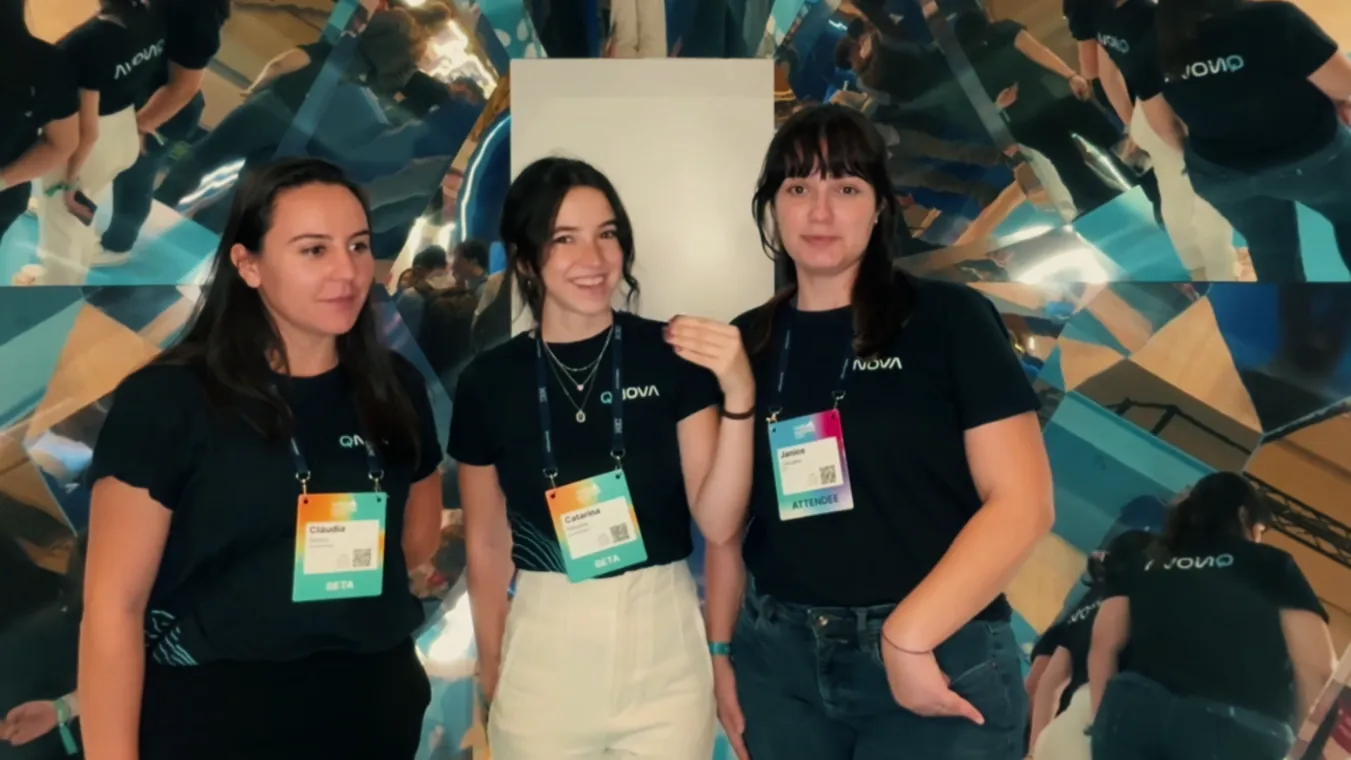 Three team members at the company stand during a technology event
