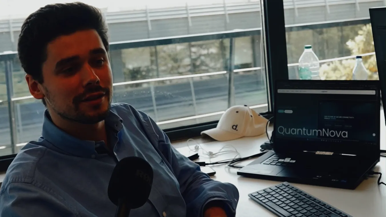 A team member recording audio at a desk